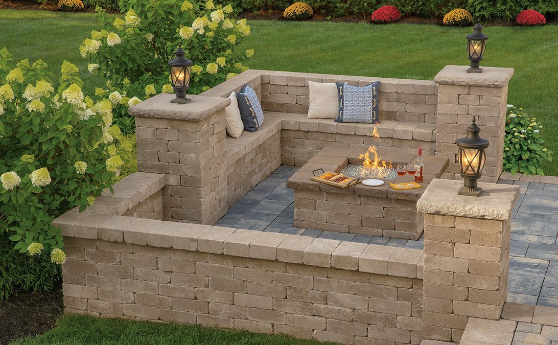 A swimming pool with a waterfall in the middle of it