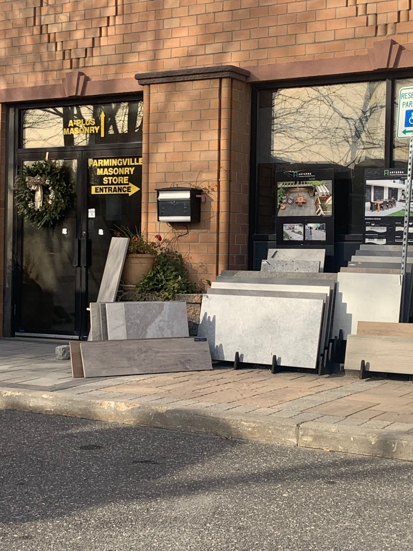 A brick building with a sign that says memorial monument store