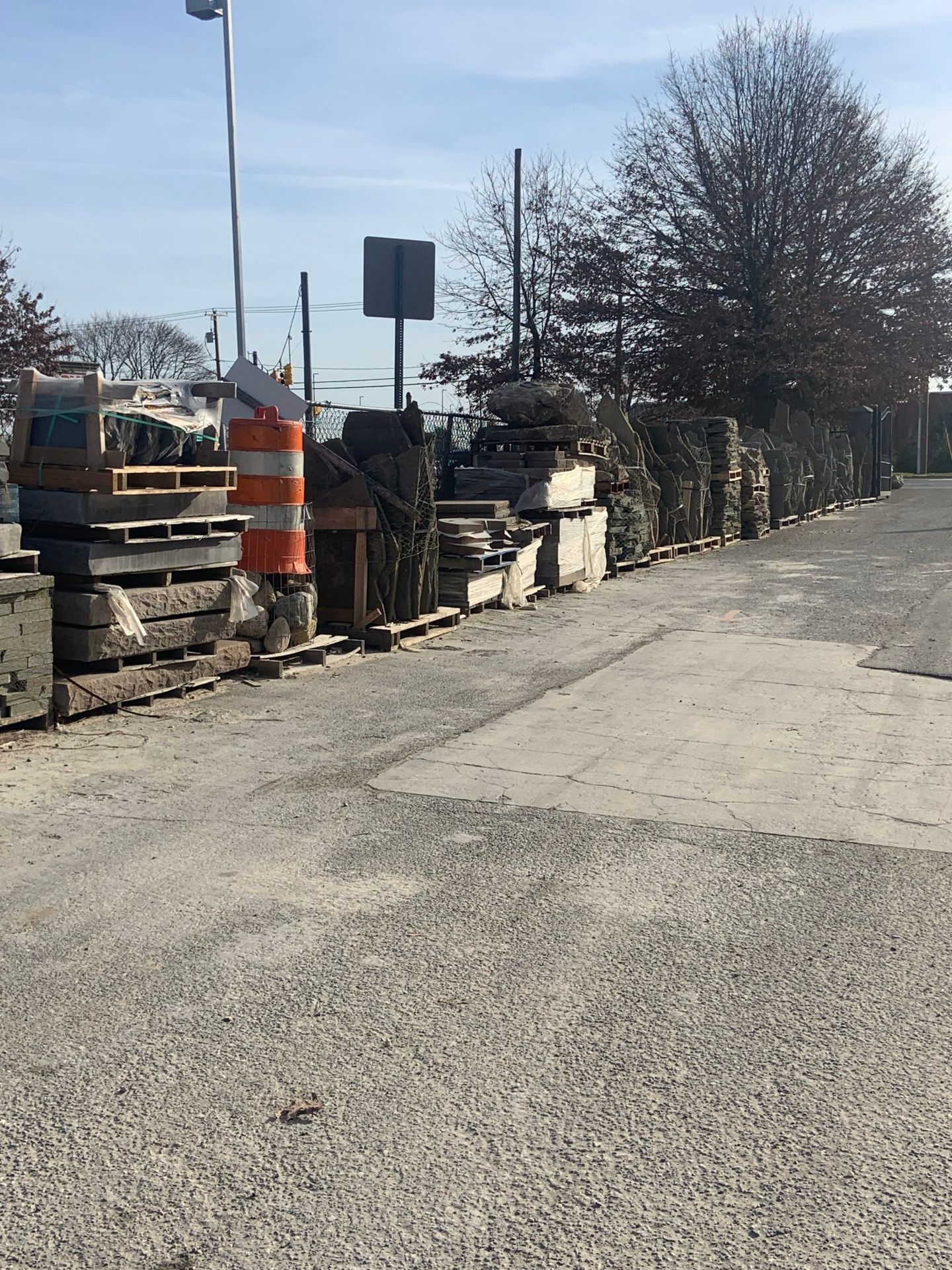 A row of concrete blocks are lined up on the side of a road.
