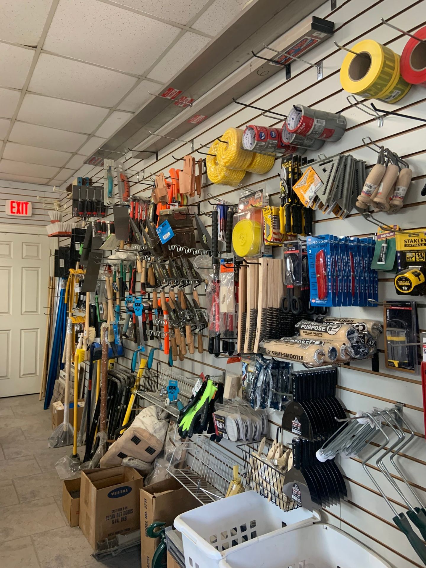 A store filled with lots of tools and a sign that says exit