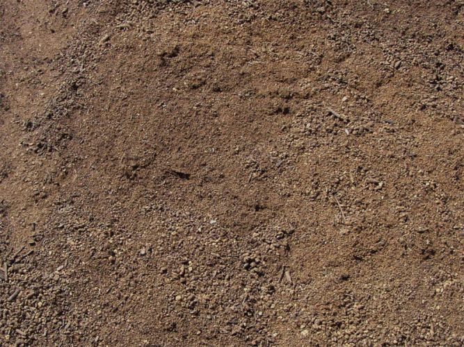 A close up of a pile of dirt and gravel.