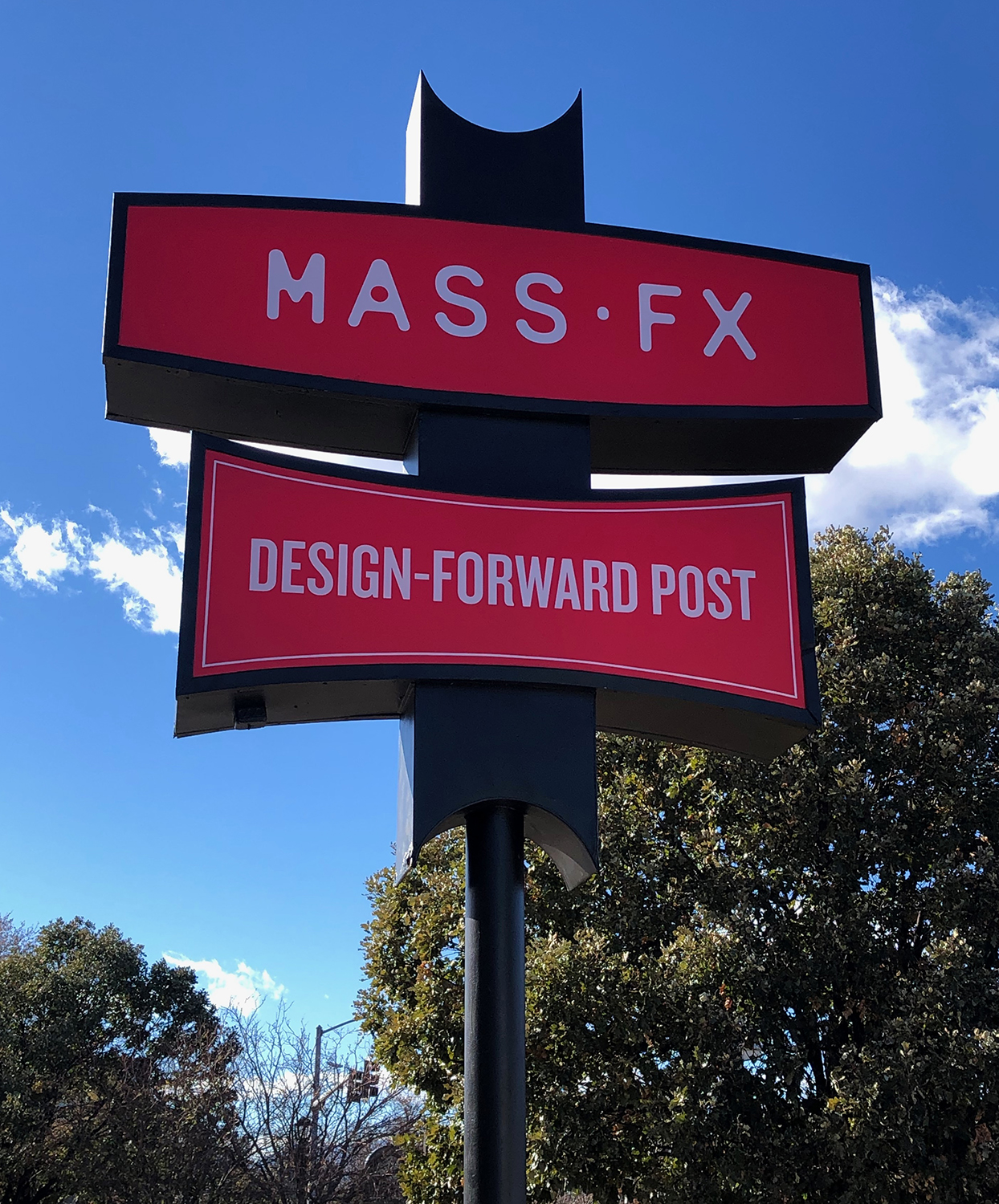 A red sign that says mass fx design forward post