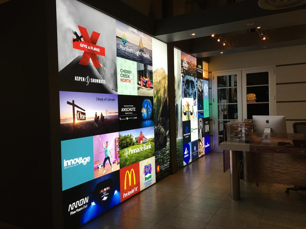 A large wall with a lot of pictures on it