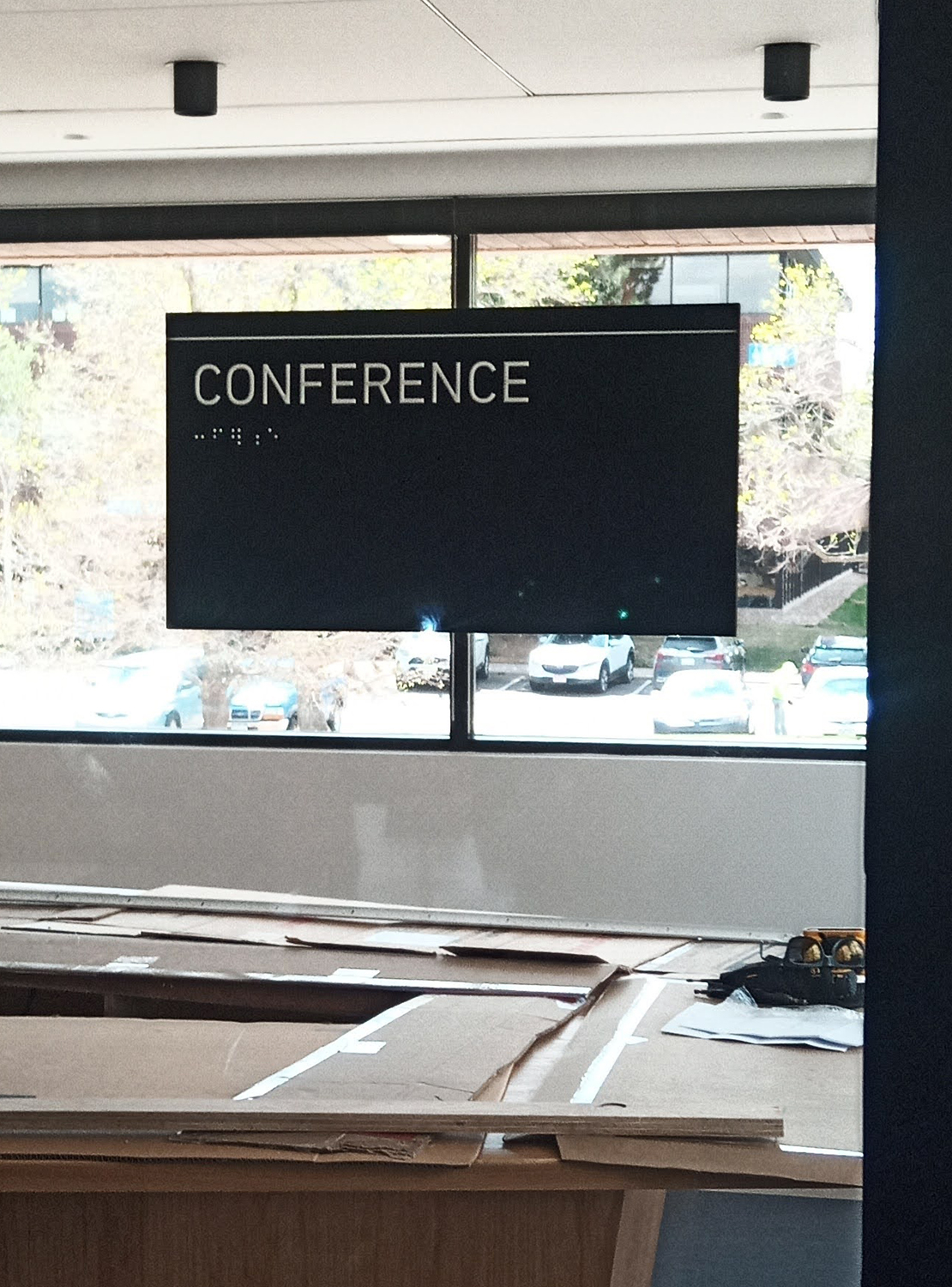 A conference room with a sign that says conference on it