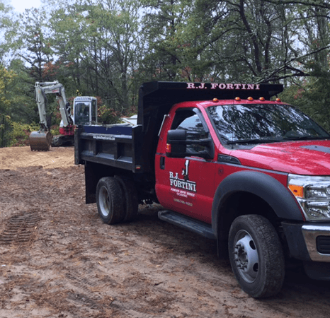 Dump truck and excavator