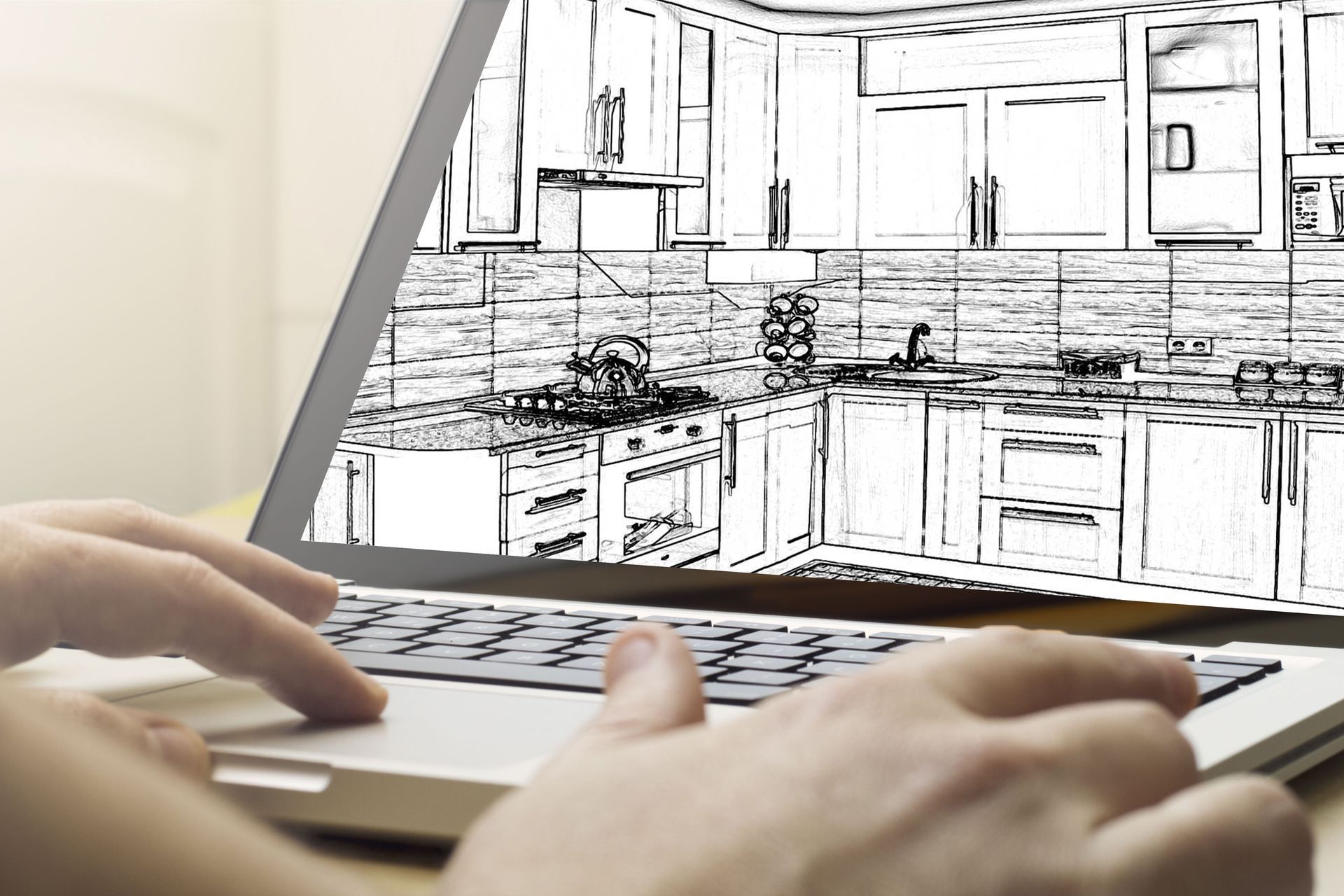 Hands using laptop displaying kitchen design sketch.