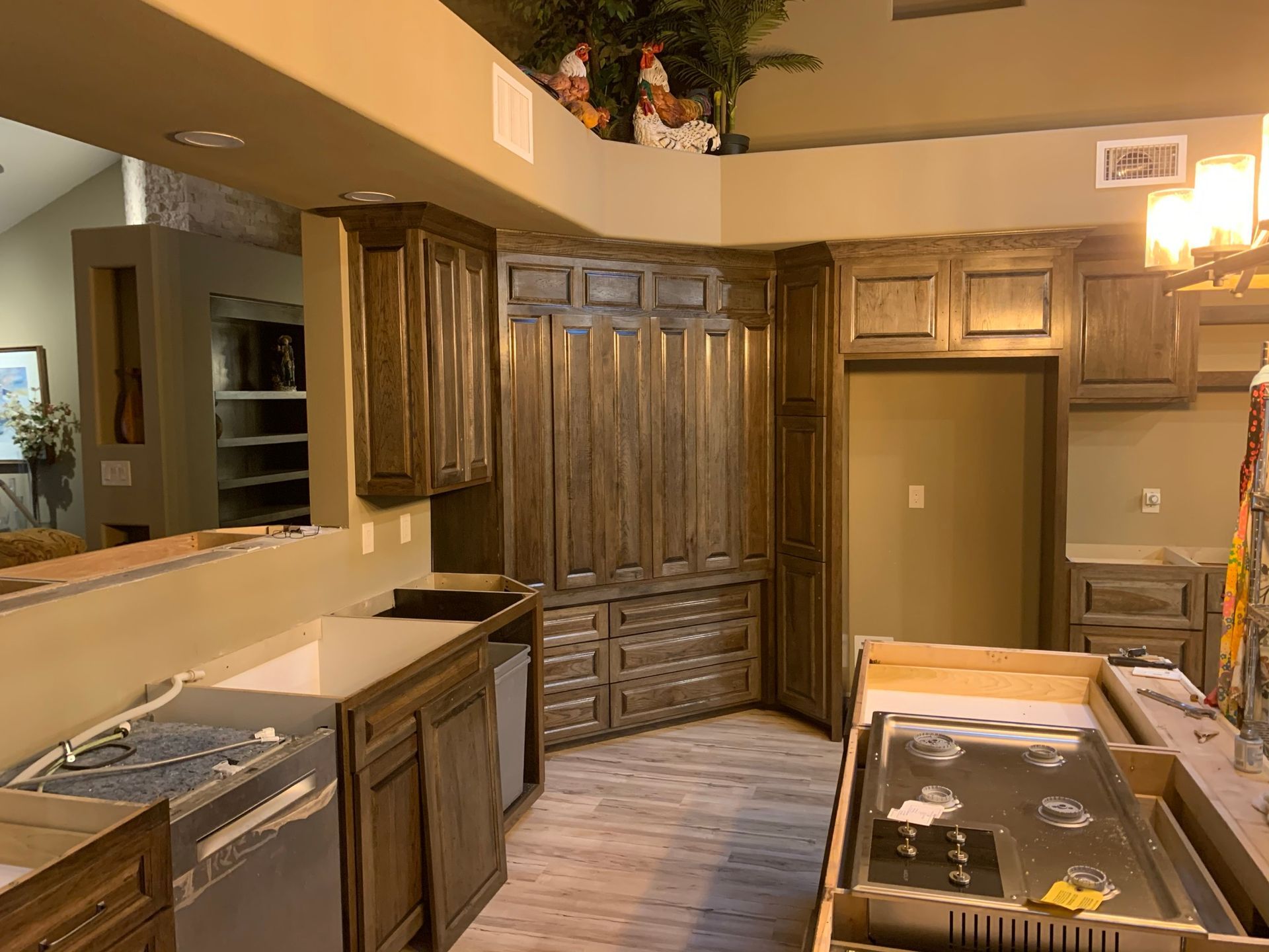 Kitchen with dark wood cabinets and appliances.