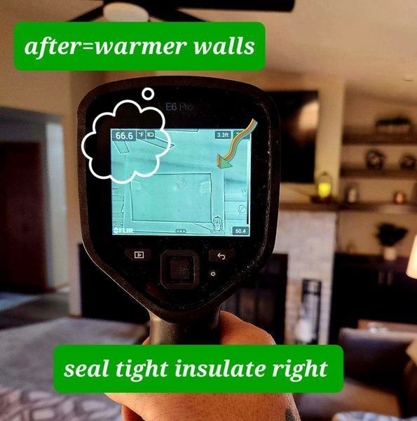 Hand holding a thermal imaging camera showing warm walls, text: 
