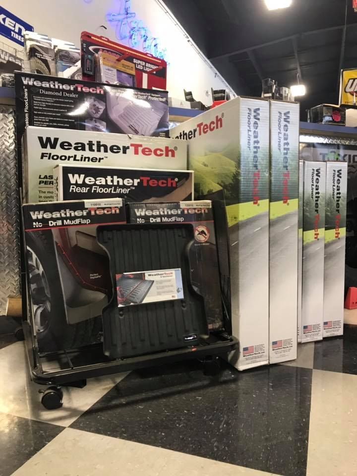 A display of weather tech floor mats in a store