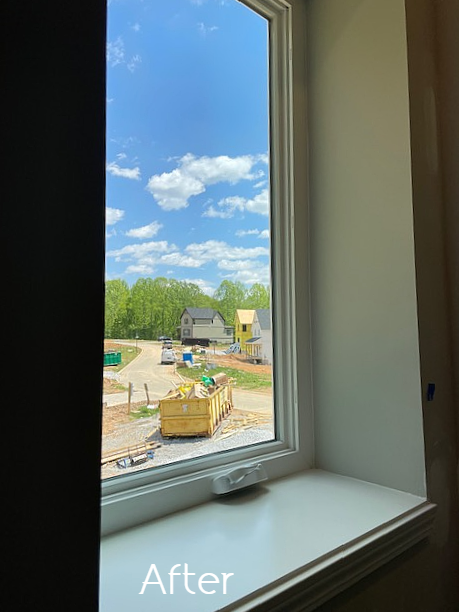 A picture of a window with a view of a construction site.