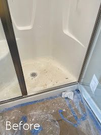 A before picture of a dirty shower stall in a bathroom.