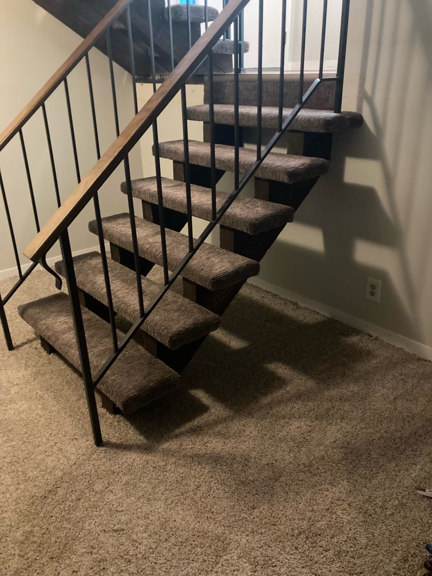 light brown carpeted staircase