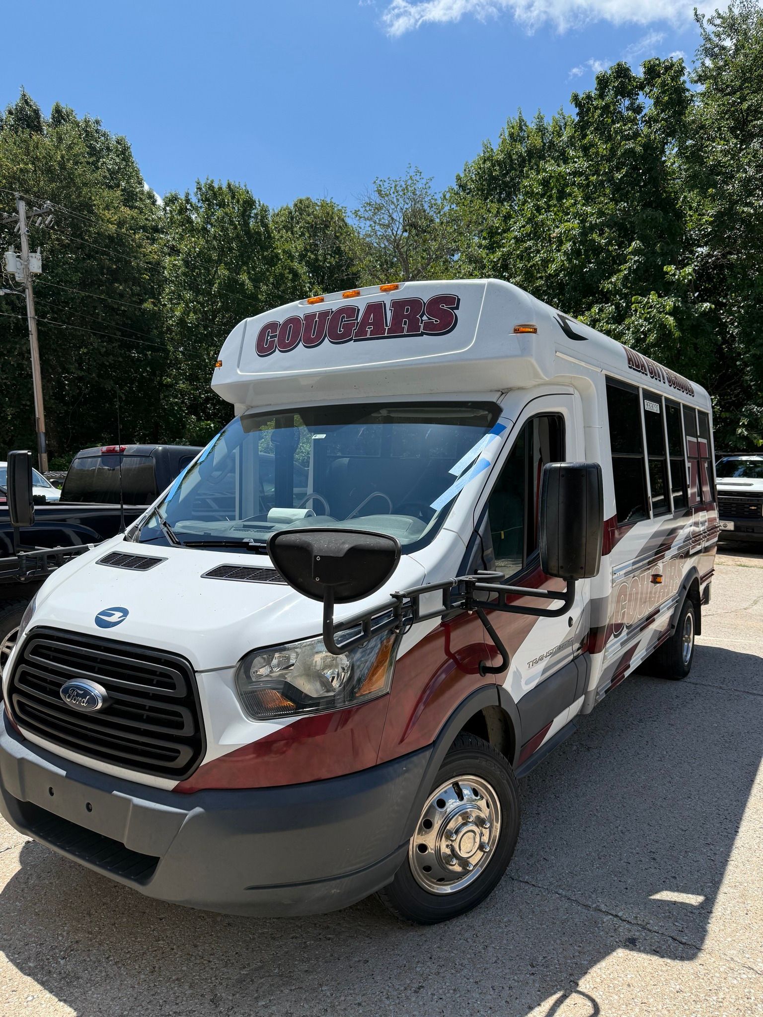 White and maroon school bus with 