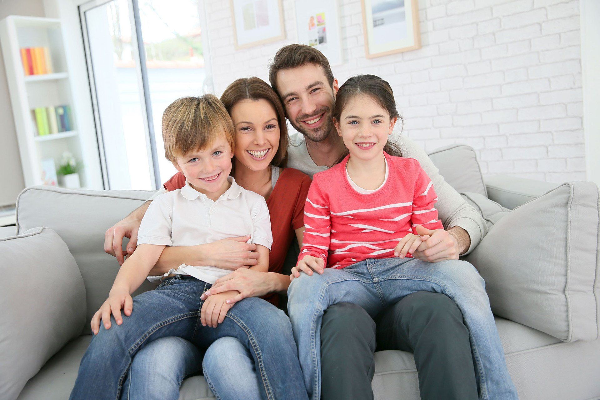 Happy Family sitting on couch