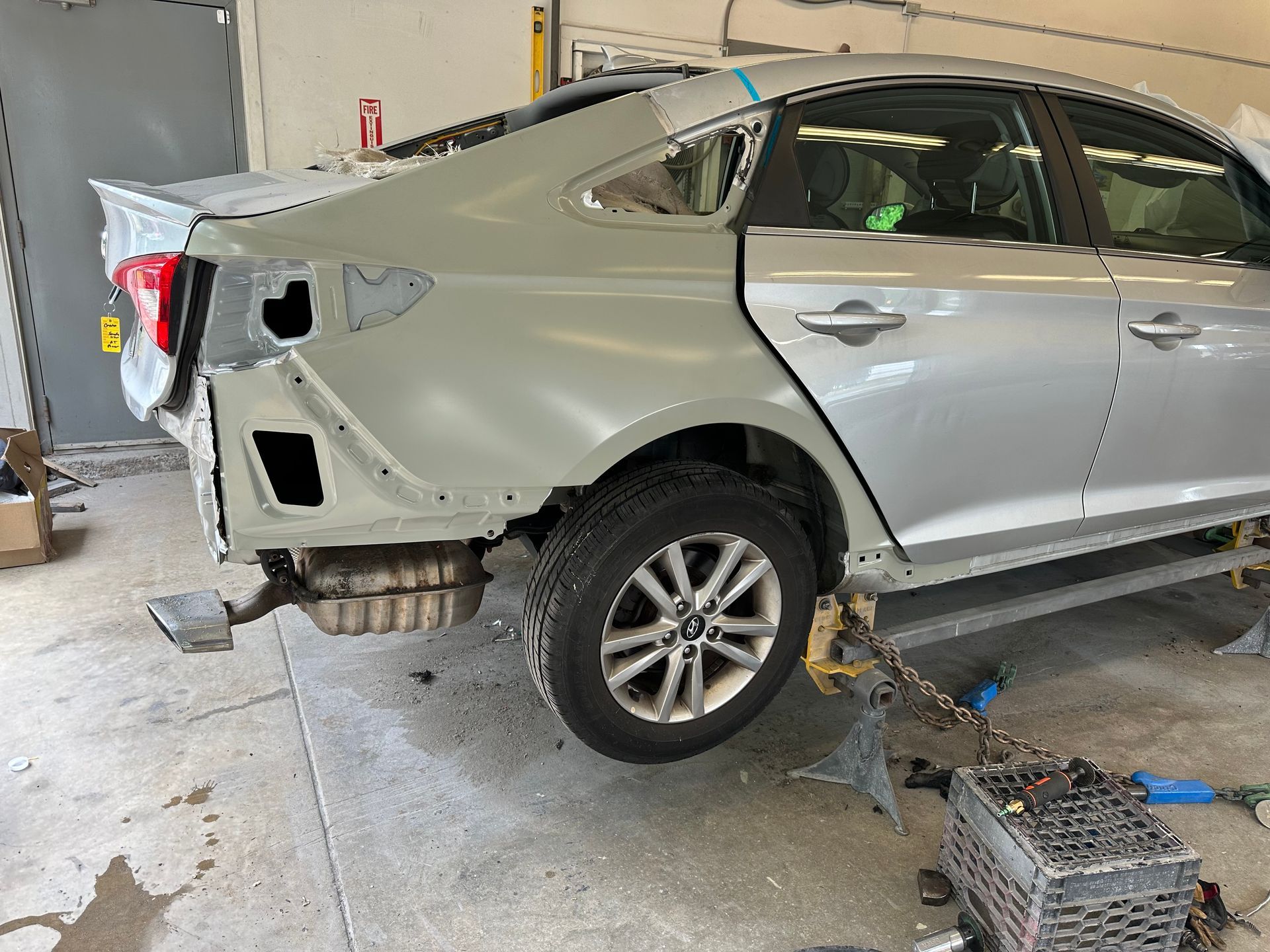 A car is being repaired in a garage after.