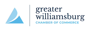 Logo for Greater Williamsburg Chamber of Commerce. Features blue triangle design and text.