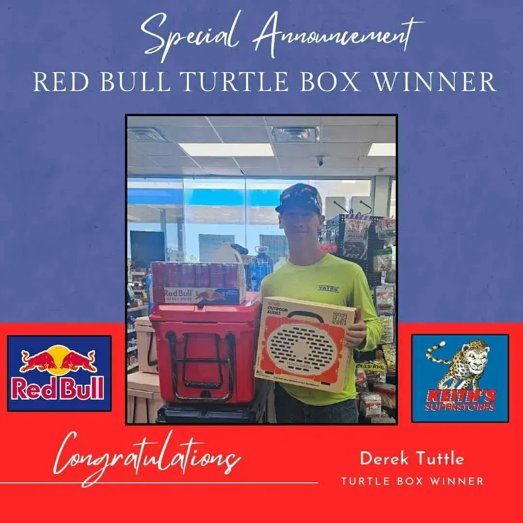 Winner holding a Red Bull Turtle Box prize box, framed by a blue and red congratulatory banner.