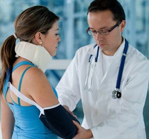 doctor cheking womans injured arm