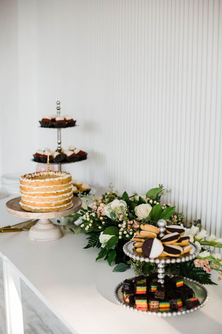There are many different types of desserts on the table.