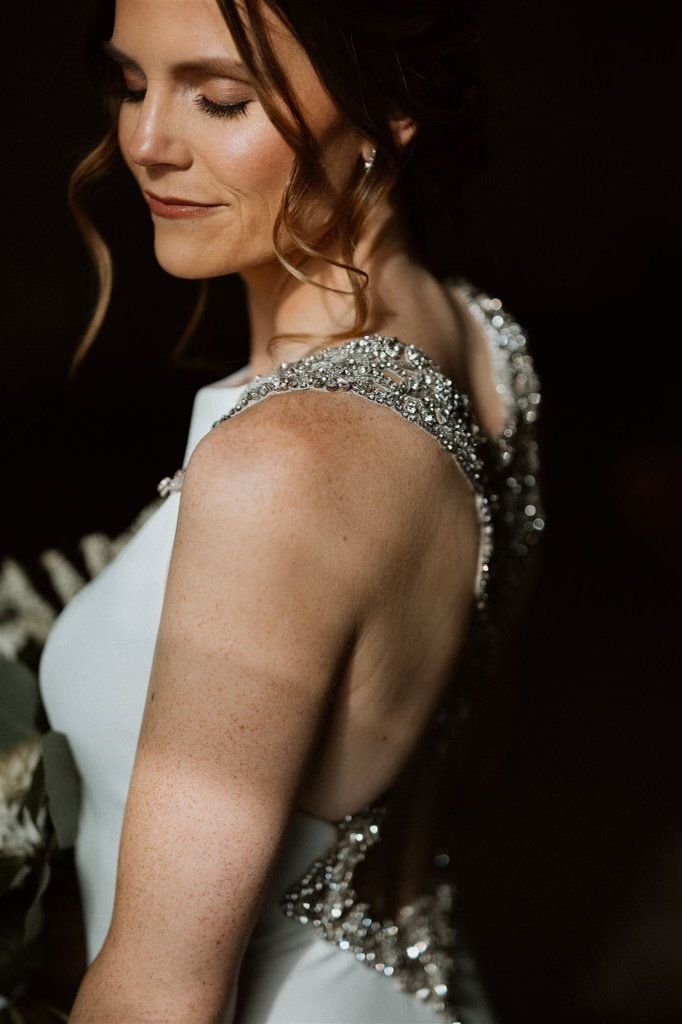 A close up of a woman in a wedding dress