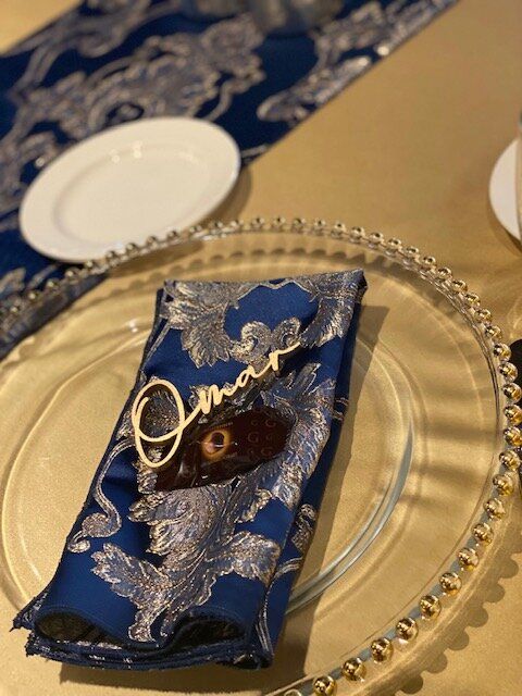 A blue napkin with the name omar on it