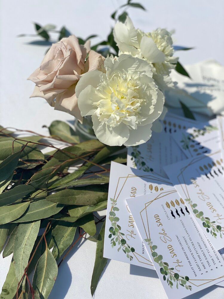 A bunch of flowers and cards on a table