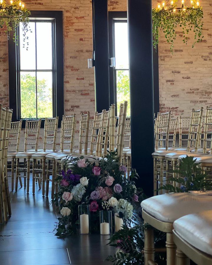A bouquet of pink and white roses and hydrangeas is sitting on a table.