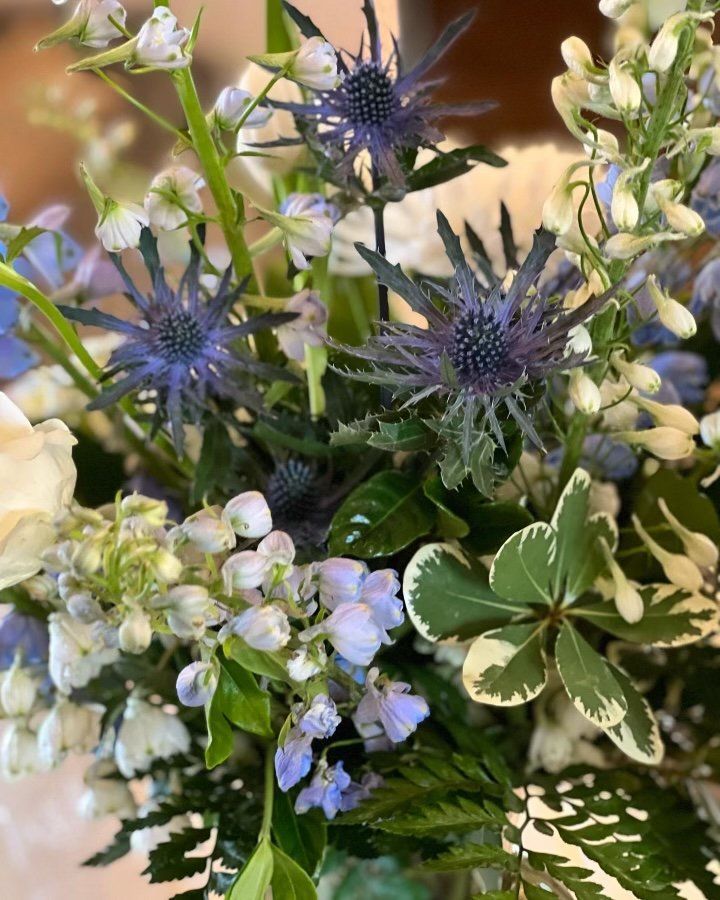 A close up of a bouquet of flowers on a table.