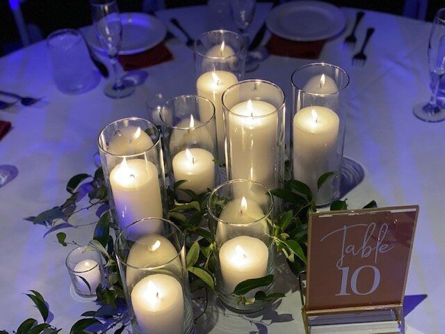 A table with candles and a table number 10