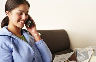 Happy women talking in phone