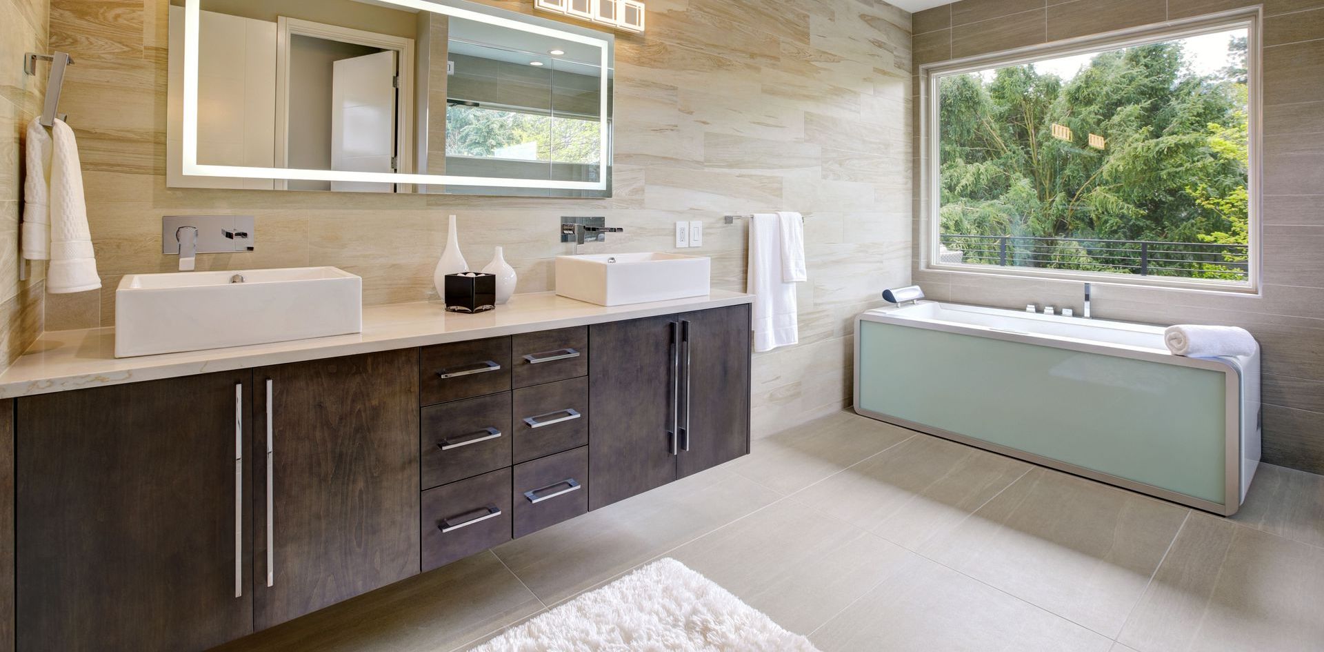 Unfinished kitchen with dark wood cabinets, white walls, and boxes on the floor and counters
