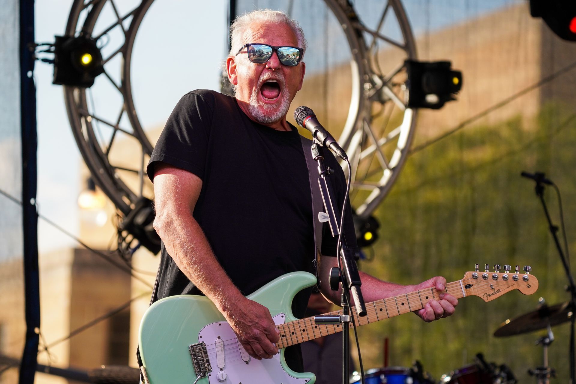 man playing an electric guitar