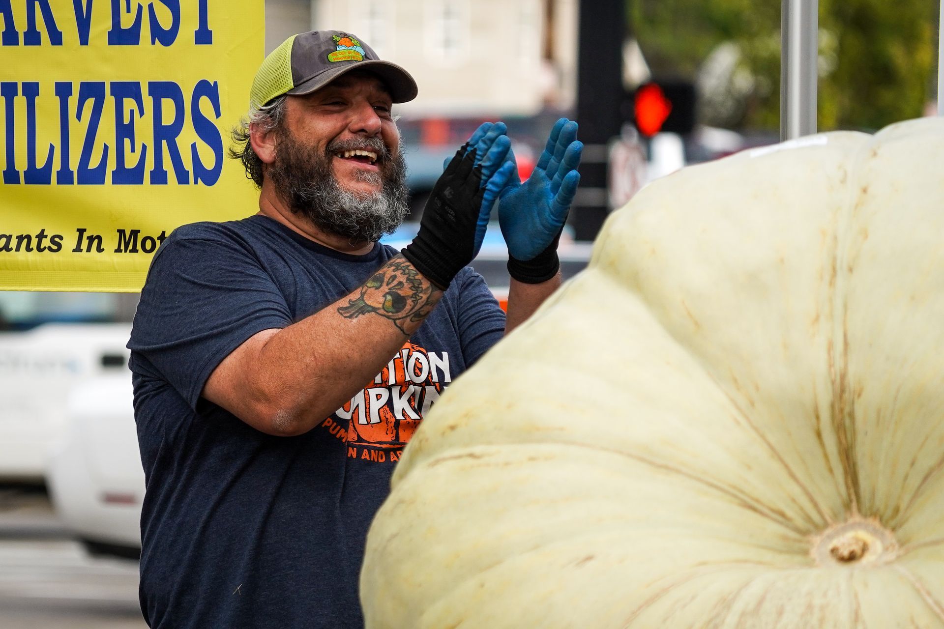 man carving a pumpkin