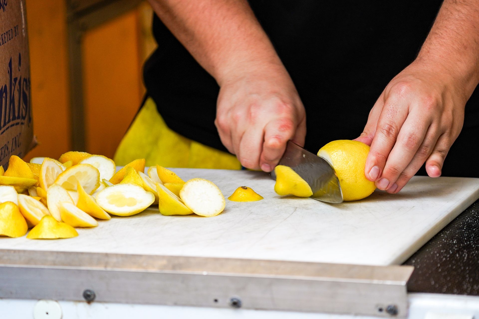 man cutting lemon