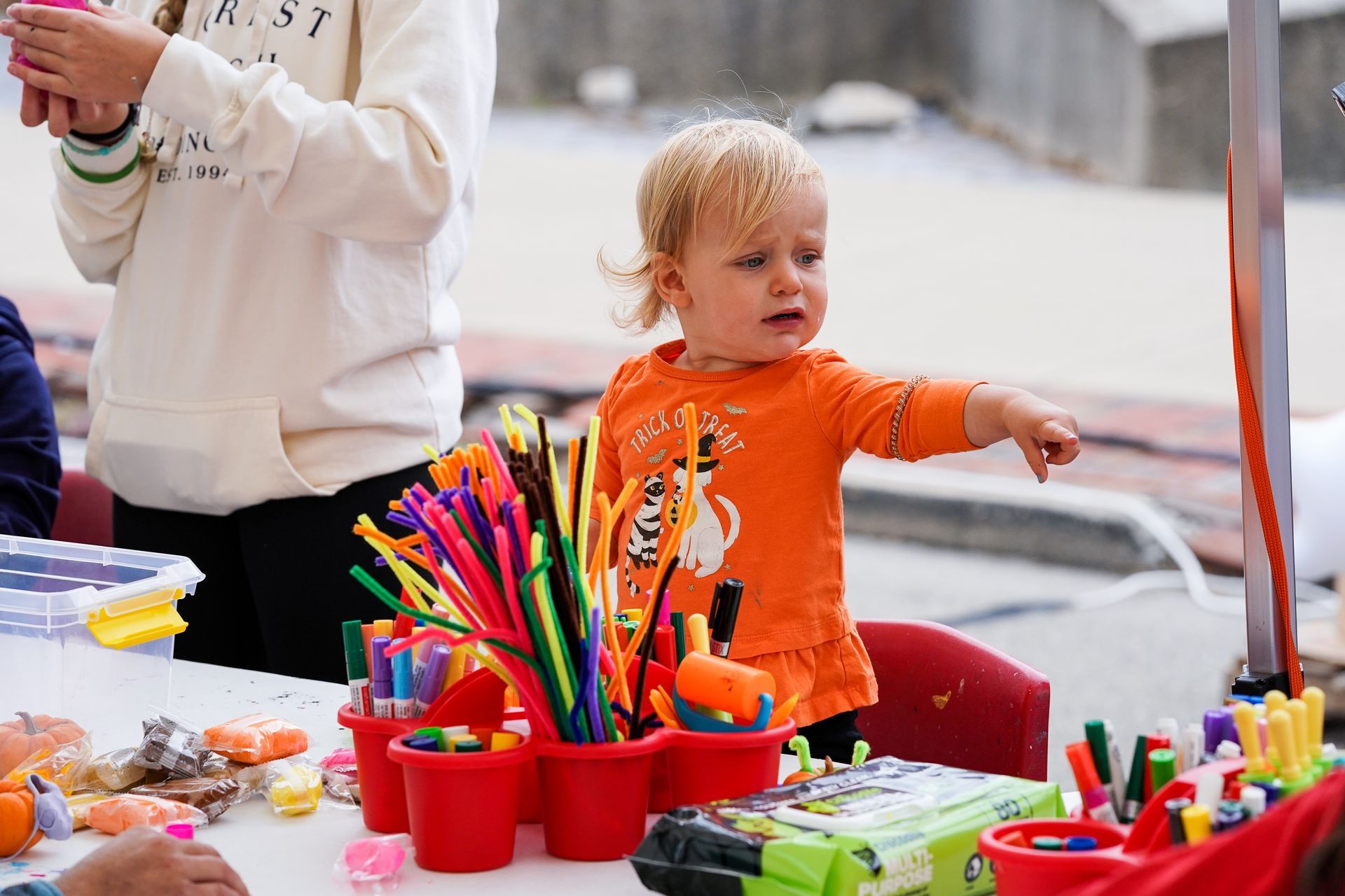 kid in orange dress