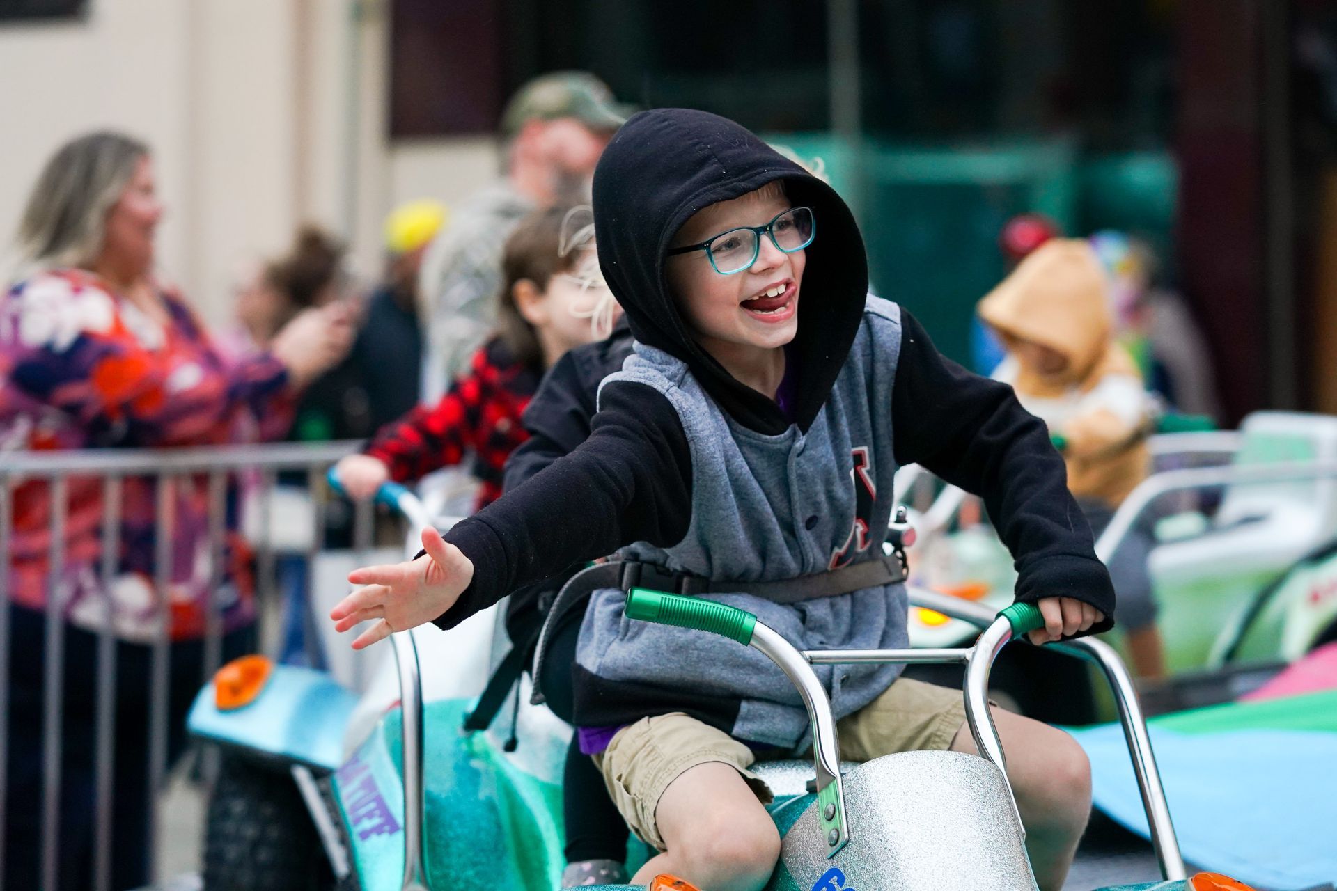 kid with jacket riding a bicycle