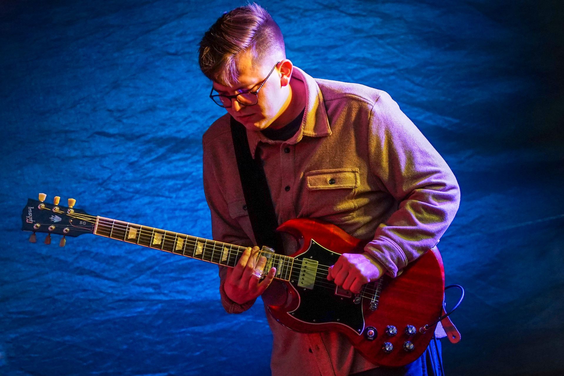 a man playing a guitar