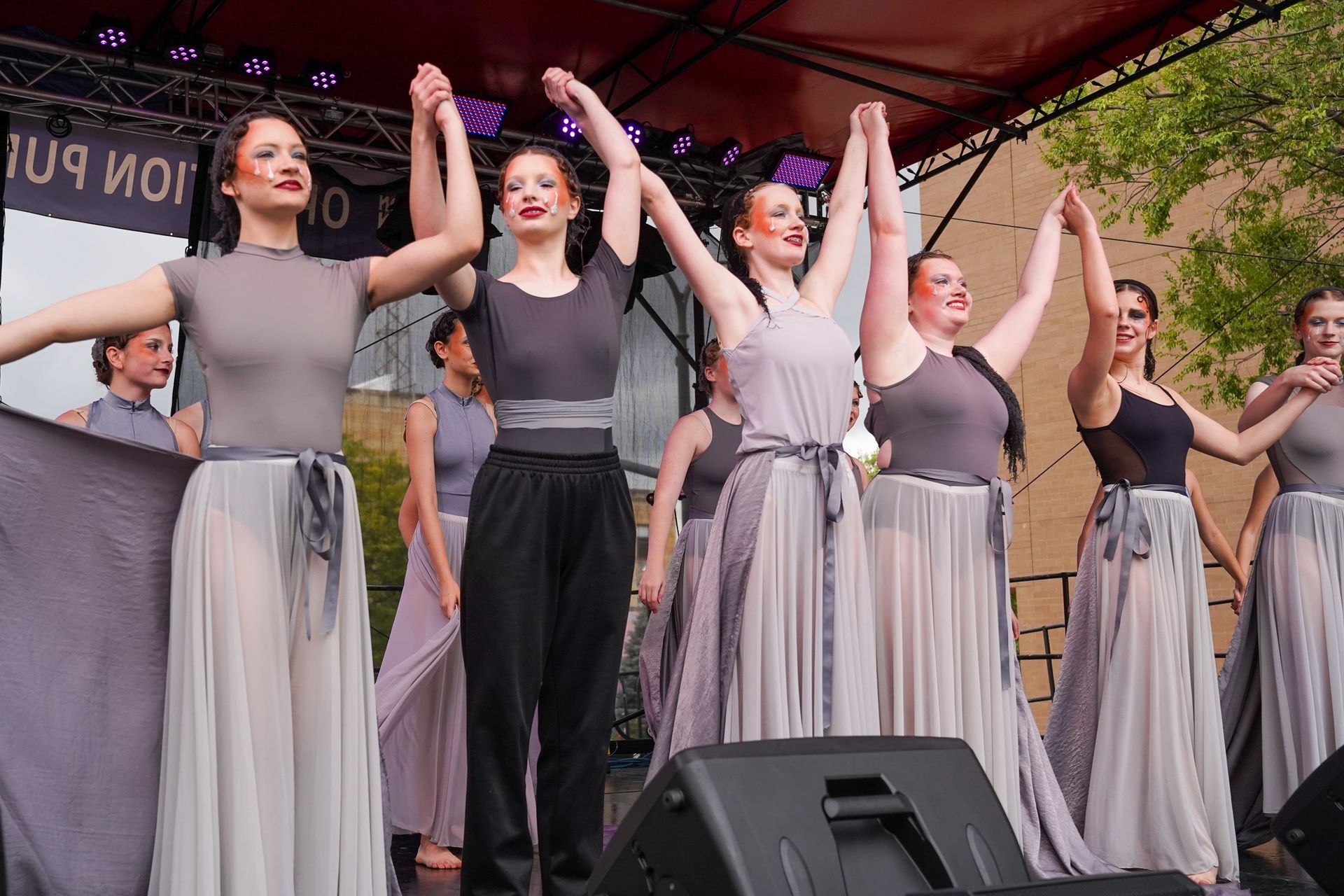 group of woman raising their hands