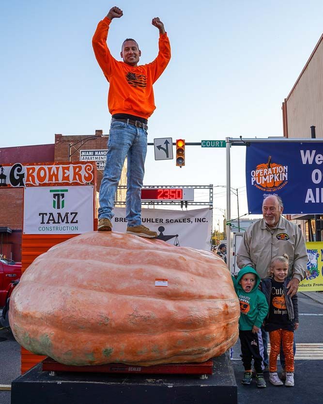 Pumpkin with man standing