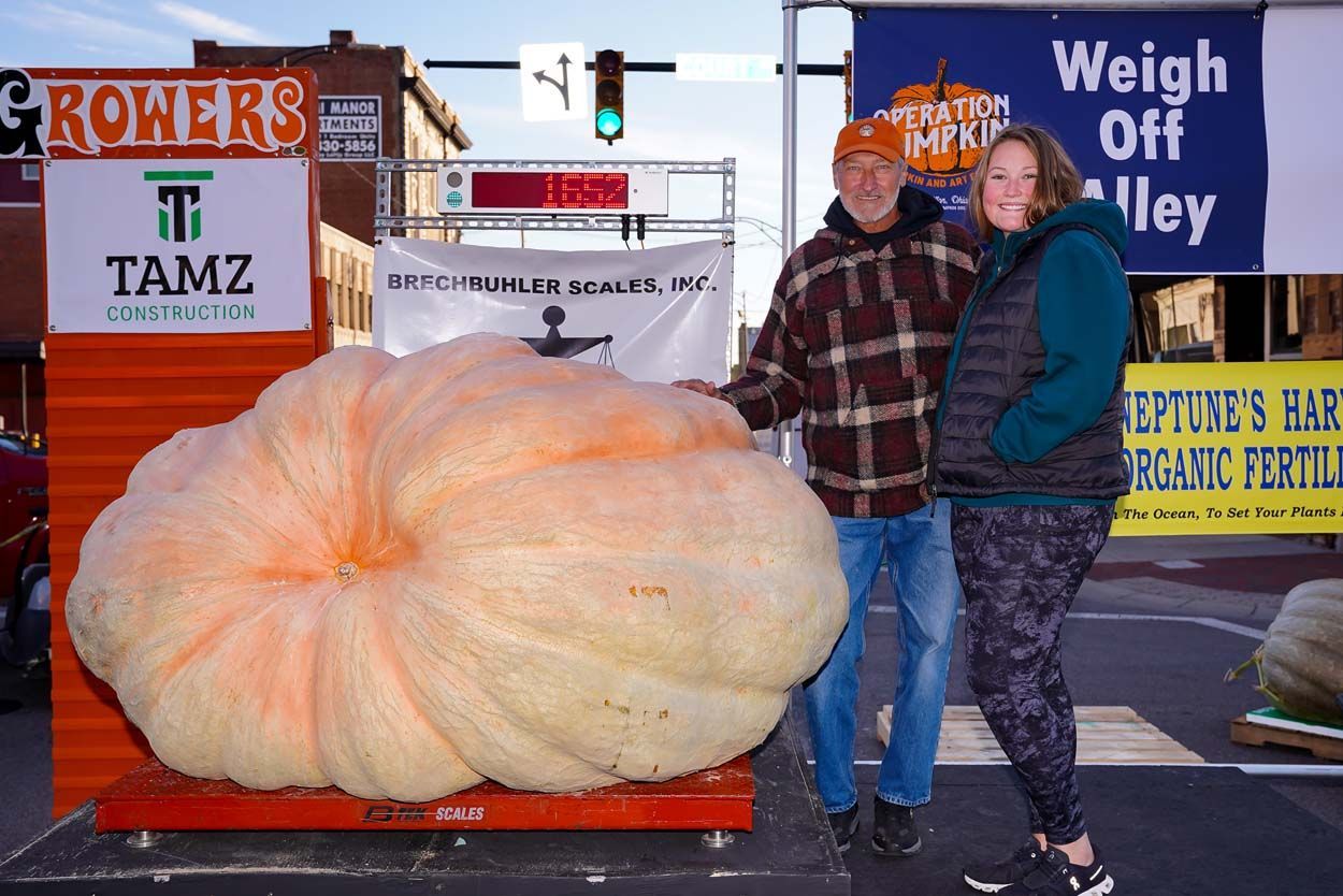 Couple beside the pumpkin