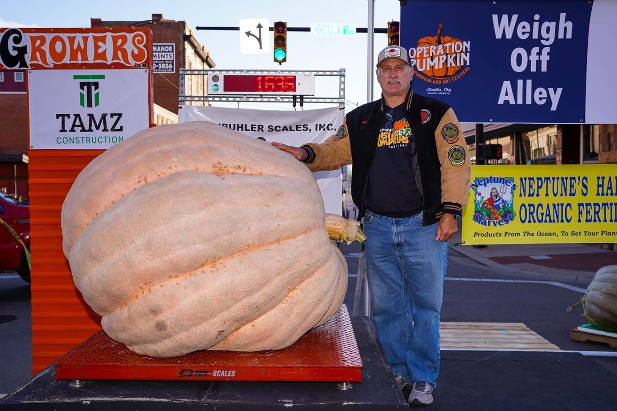 Man beside a pumpkin