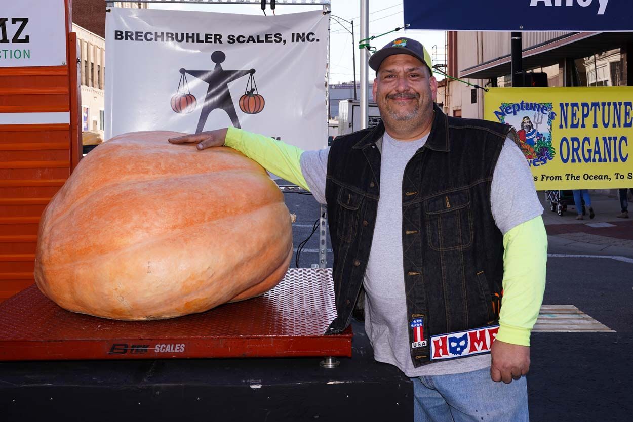 Man holding the big pumpkin