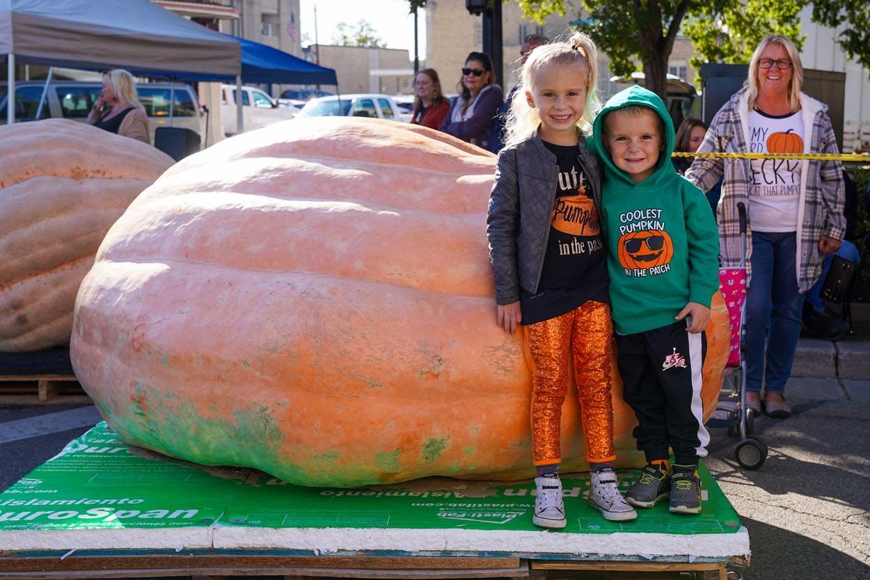 Kids beside the pumpkin