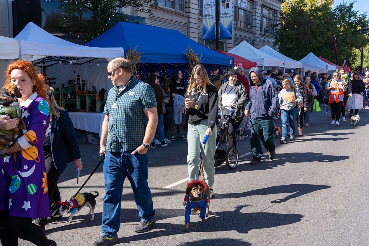 Lady and a small dog on parade