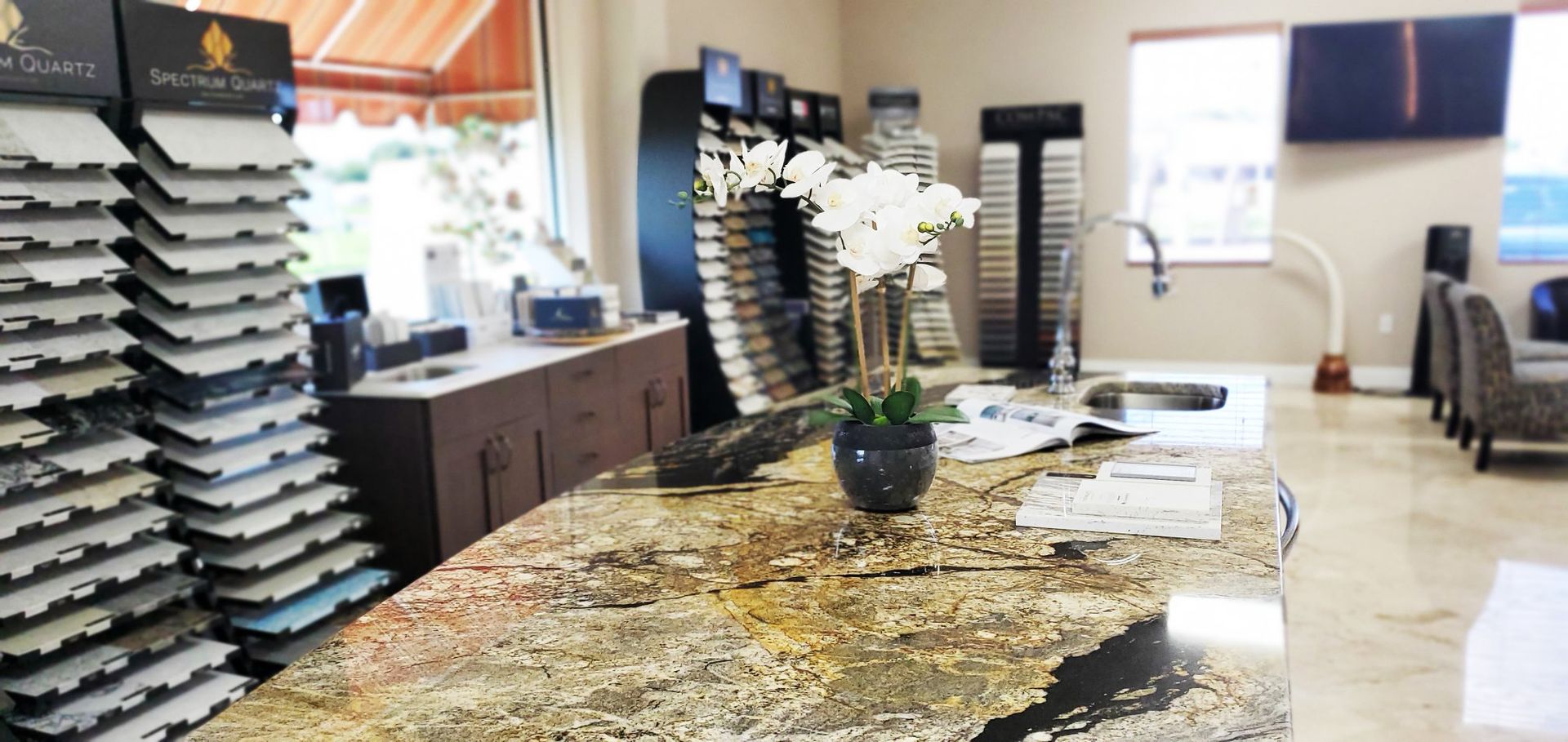 A kitchen with a granite counter top and a sink