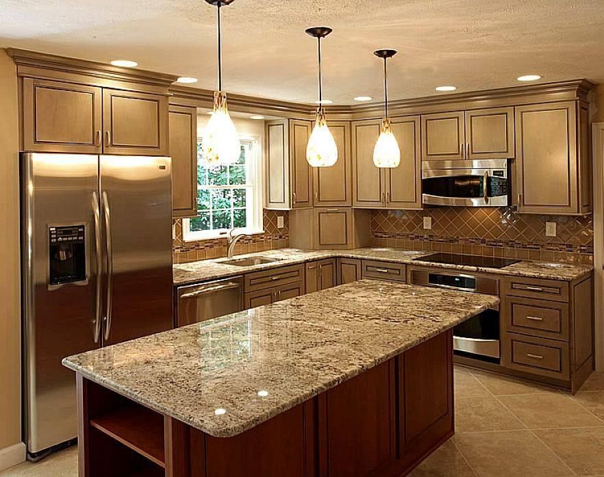A kitchen with granite counter tops and stainless steel appliances