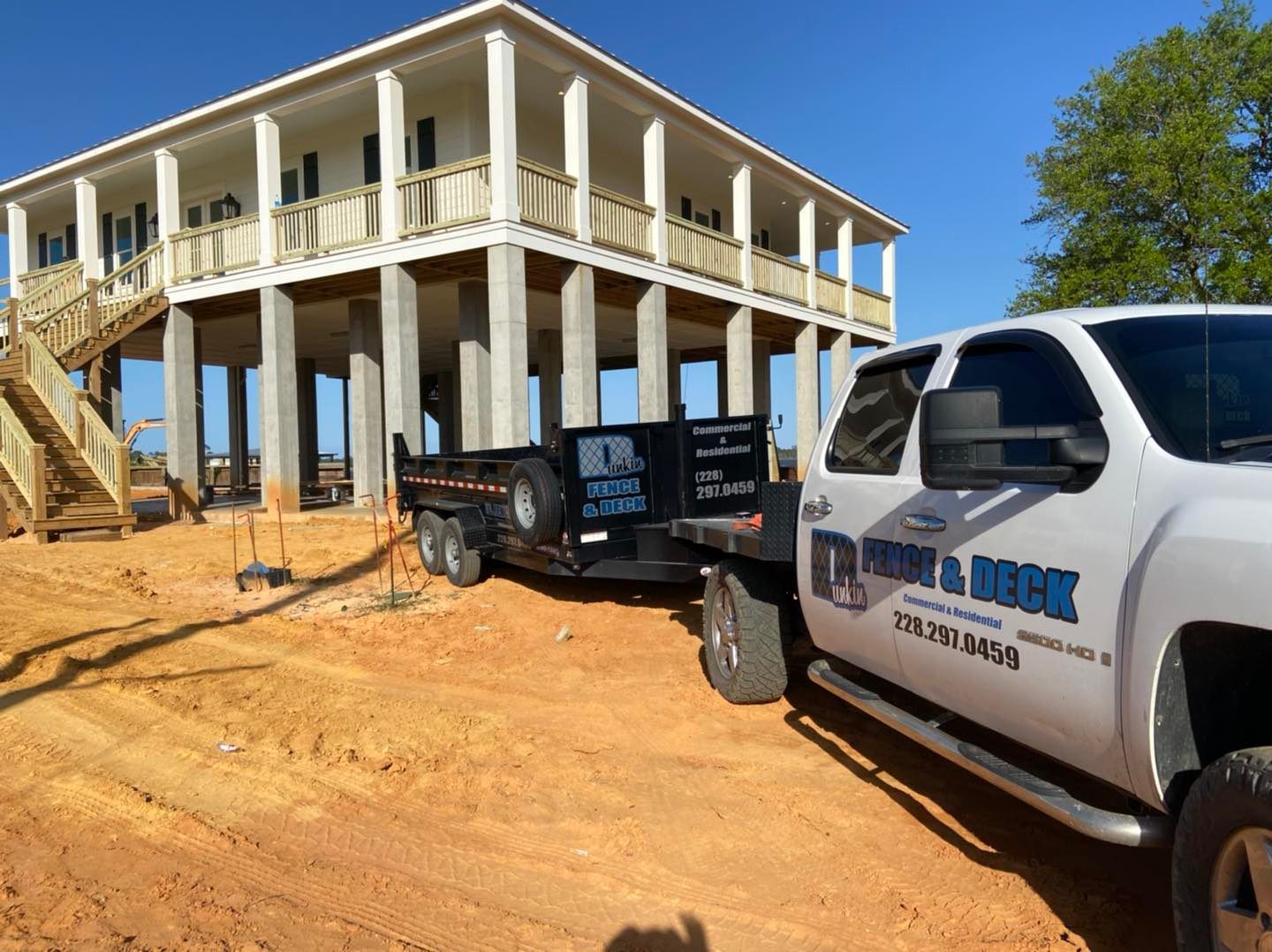 dunkin fence and deck truck onsite