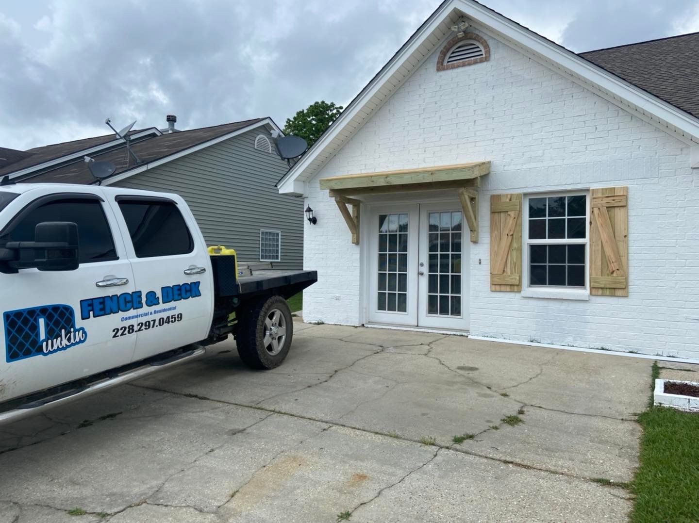 dunkin fence and deck truck onsite