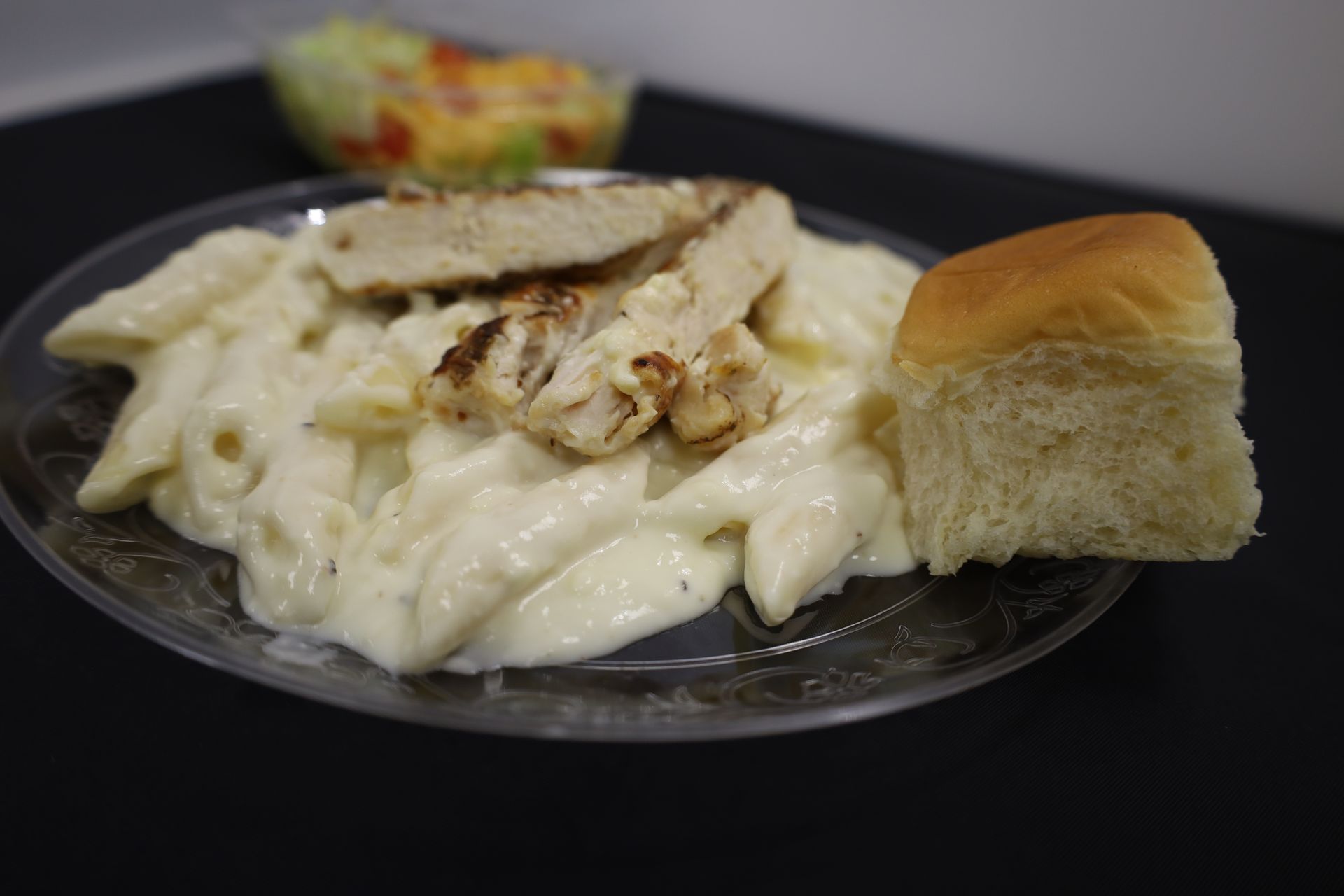 Breaded chicken strips in deli serving pan