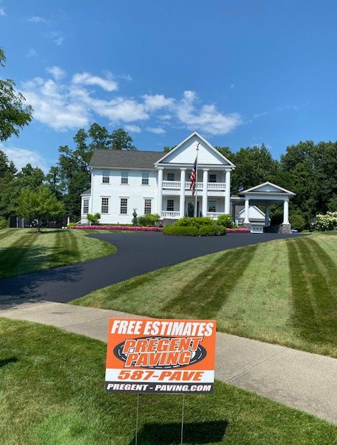 A large white house with a sign in front of it that says free estimates